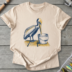 Pelican Finds Empty Bucket T-Shirt in Sand | River Giants Club