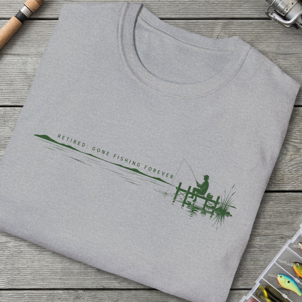 Folded gray sweatshirt with fishing-themed design on a wooden surface